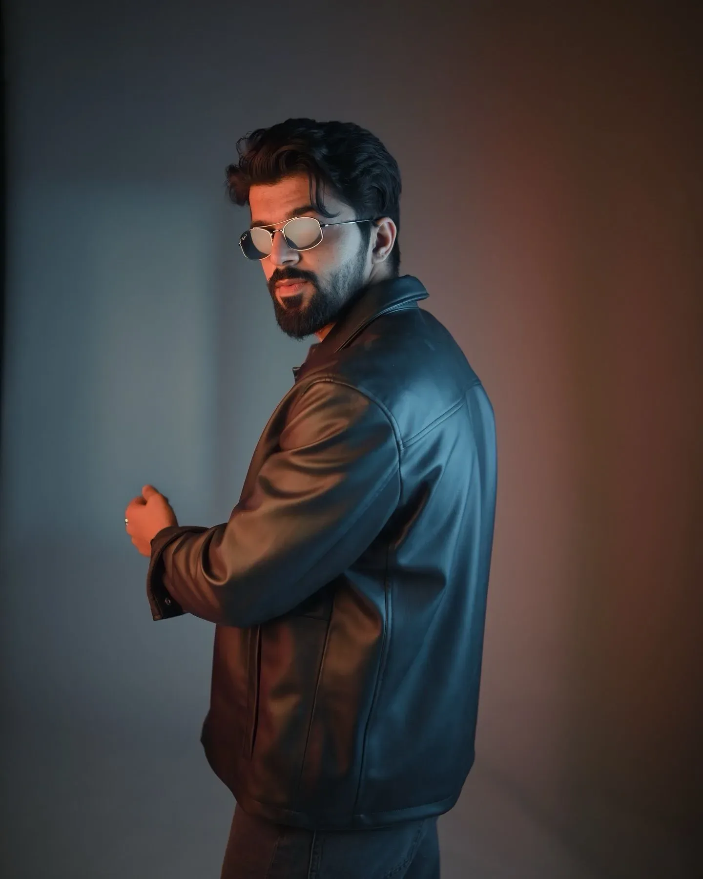 Dual-tone Leather Jacket Over-the-shoulder Studio Portrait AI Photo Prompt preview example result