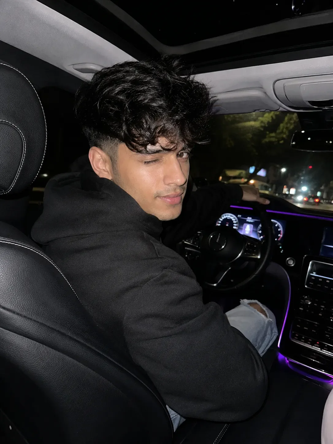 Luxury drive under city lights AI Photo Prompt preview example result