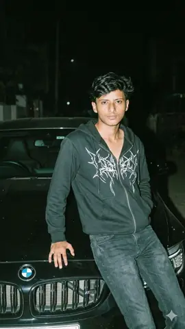 Young Boy Leaning On Bmw Car At Night Gemini Prompt - copy paste on Gemini AI