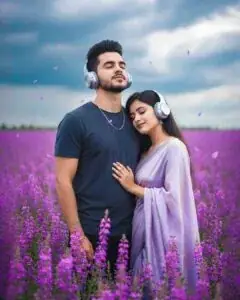 A 4K photorealistic vertical portrait of a couple in a purple flower field, wearing silver headphones with soft storm-light and floating petals for a dreamy romantic vibe. - copy paste viral AI prompt