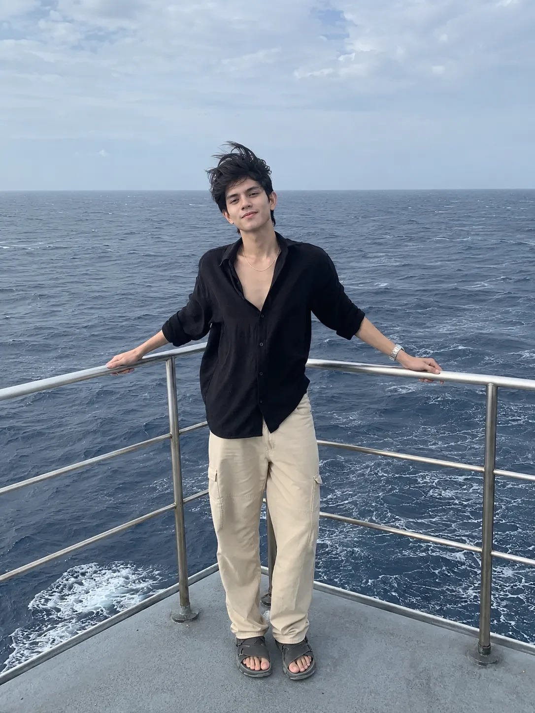 Young man on a boat deck in sea AI Photo Prompt preview example result